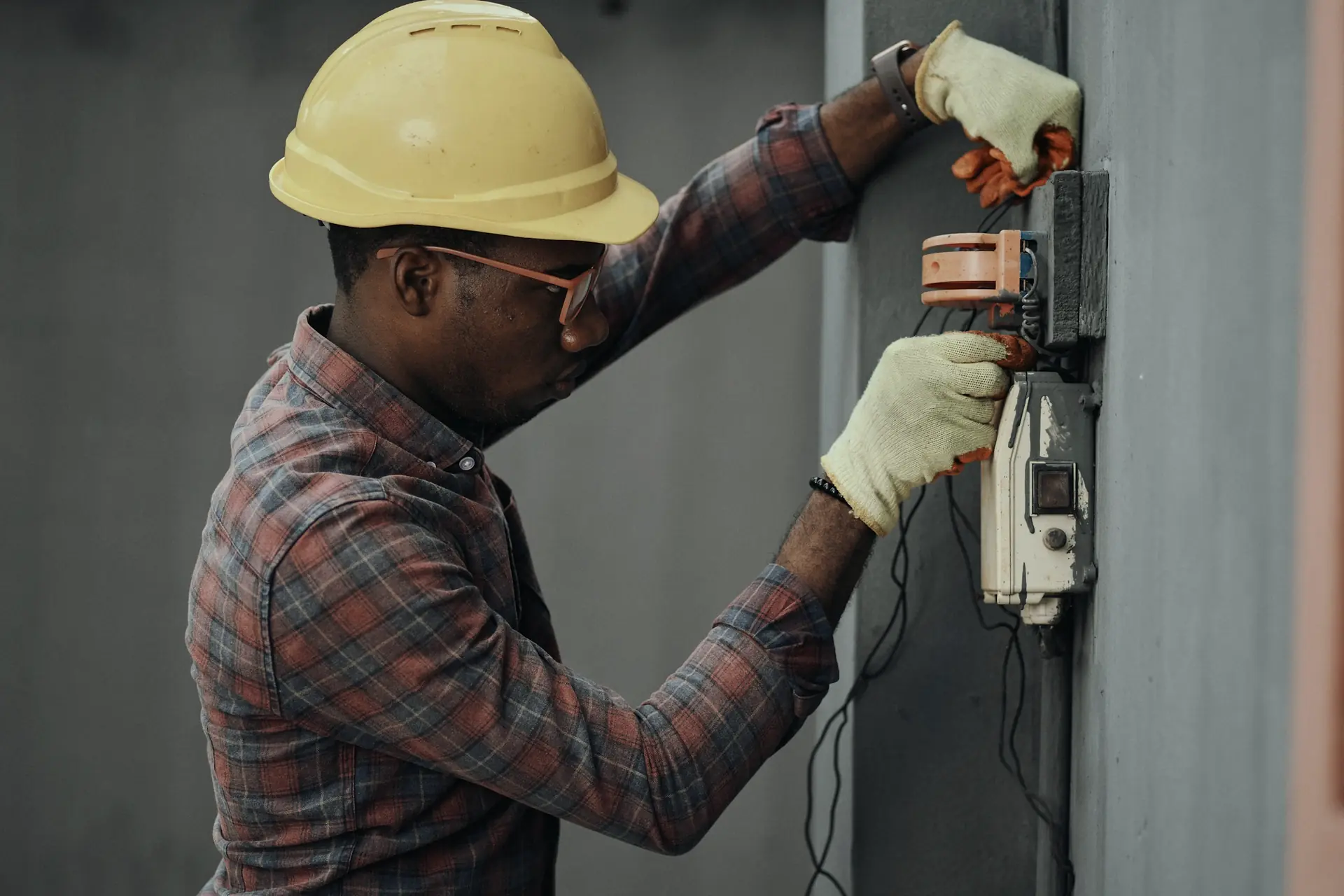 Electrician working on an electricity meter and DB board