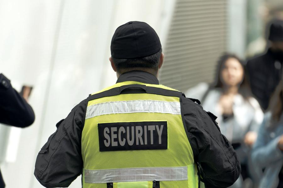 Security officer in a high-visibility vest