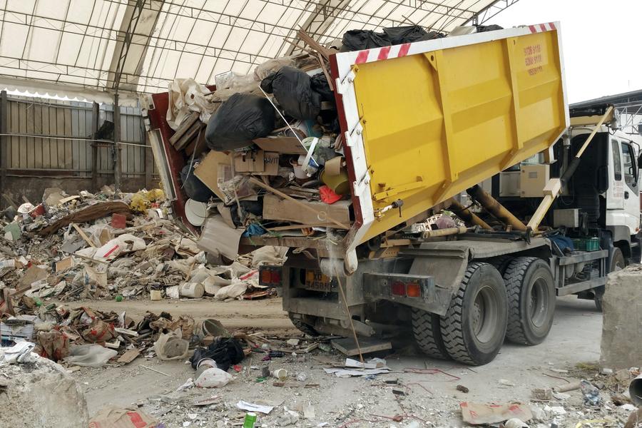 Tipper truck offloading rubble and construction waste